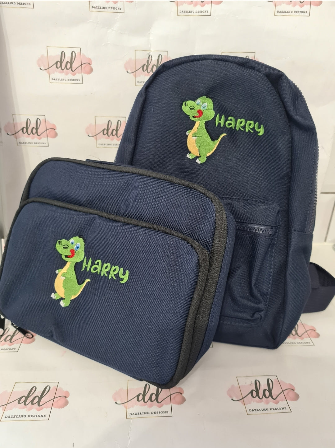 Green dinosaur embroidered backpack