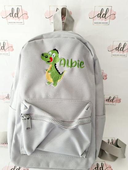 Green dinosaur embroidered backpack