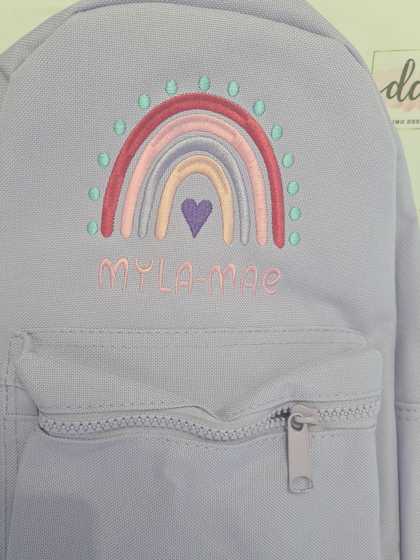 Spotty rainbow embroidered backpack